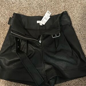 Top shop black leather shorts.